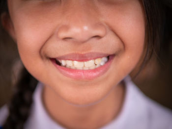 Close-up portrait of a smiling young woman