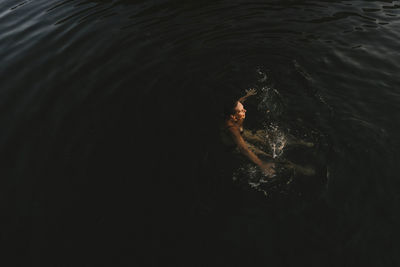 High angle view of woman swimming