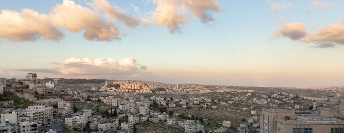 High angle view of townscape against cloudy sky