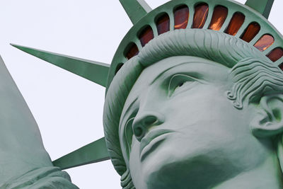 Low angle view of statue against sky