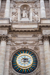 Low angle view of clock on building