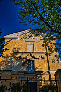 Low angle view of building against blue sky