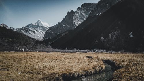 Scenic view of snowcapped mountains against sky