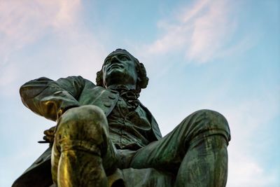 Low angle view of statue against sky