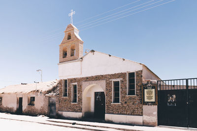 Low angle view of old building against clear sky