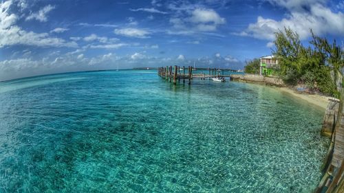 Scenic view of sea against cloudy sky