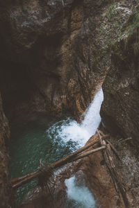 Scenic view of waterfall against sky