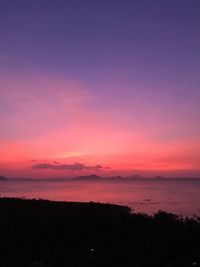 Scenic view of sea against romantic sky at sunset