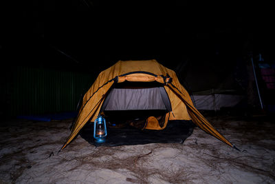 Tent against black background
