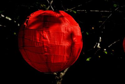 Close-up of red lantern hanging at night