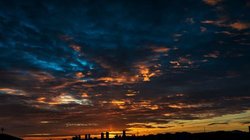 Low angle view of dramatic sky during sunset