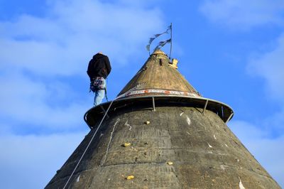 Low angle view of built structure against blue sky