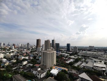 High angle view of buildings in city against sky