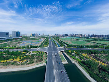 High angle view of highway in city against sky