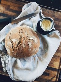 High angle view of homemade bread on table with butter