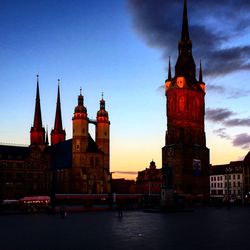 Street by marktkirche unser lieben frauen against sky during sunset