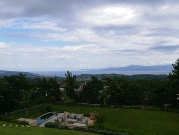 Scenic view of landscape against cloudy sky