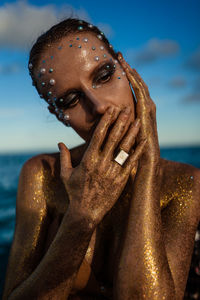 Portrait of a young woman with creative makeup