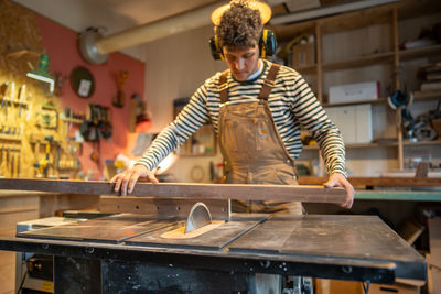 Portrait of young man working in workshop