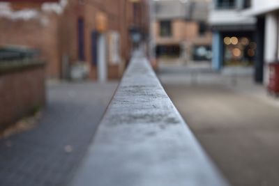 Surface level of road by buildings in city