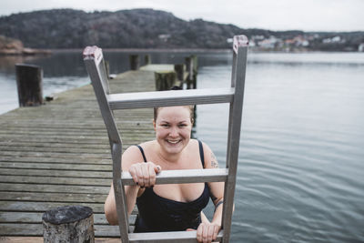 Smiling woman at lake