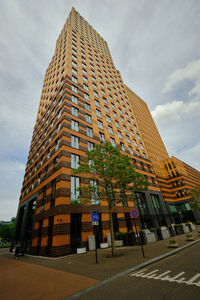 Amsterdam, netherlands - symphony building in business district zuidas. low angle view.