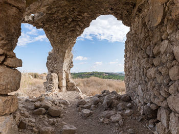 Panoramic view of rocks on field against sky