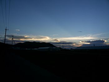 Silhouette of mountain against sky at sunset