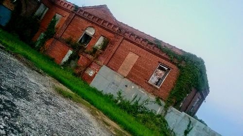 Low angle view of old building against sky