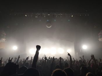 People enjoying music concert at night