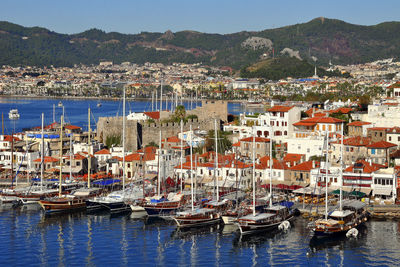 Boats moored at harbor