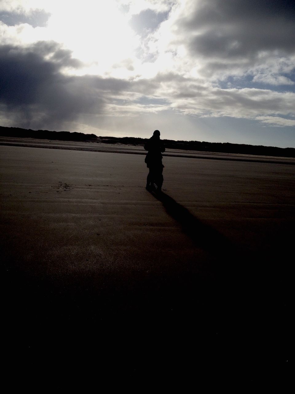 sky, full length, lifestyles, leisure activity, standing, silhouette, cloud - sky, walking, rear view, men, tranquil scene, landscape, tranquility, cloud, field, sunlight, nature, person