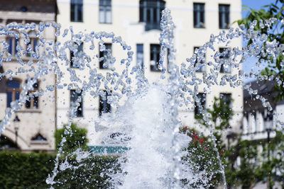 Close-up of frozen buildings during winter