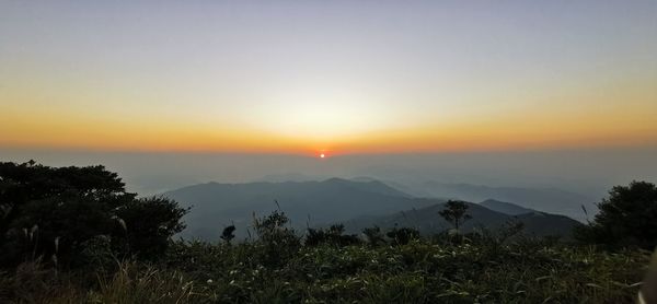 Scenic view of mountains against sky during sunset