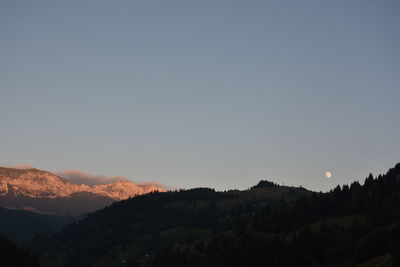 Scenic view of silhouette mountains against clear sky