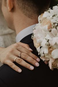 Midsection of woman holding flower bouquet