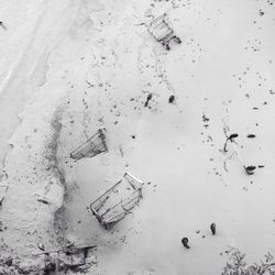 High angle view of damaged shopping carts at beach