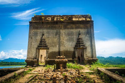 Old temple building against sky