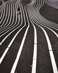High angle view of woman on patterned road