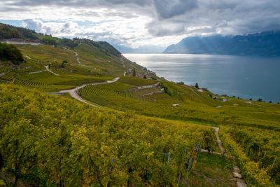 Scenic view of sea and mountains against sky