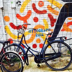 Bicycle parked against building