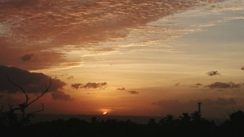 Scenic view of silhouette landscape against sky at sunset