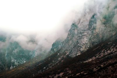 Scenic view of mountains during foggy weather