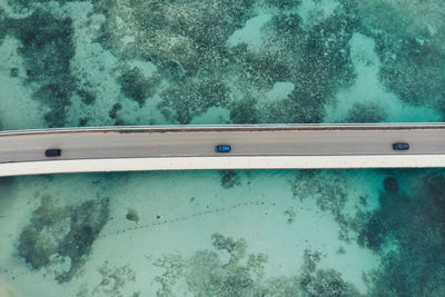 Aerial view cars on bridge over sea