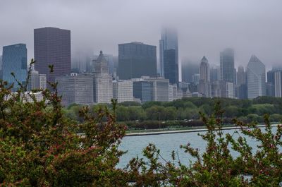 Buildings in city against sky