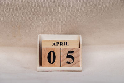 Close-up of information sign on table