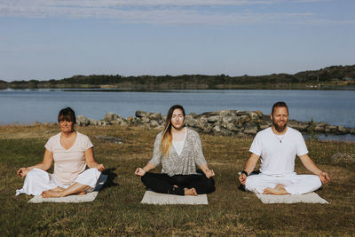 People meditating at sea