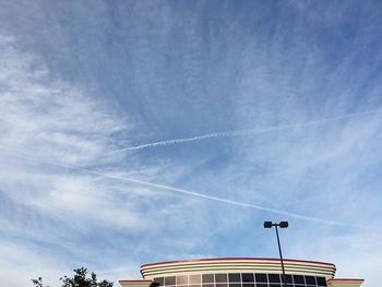 Low angle view of vapor trail against sky