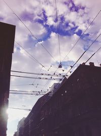 Low angle view of building against cloudy sky