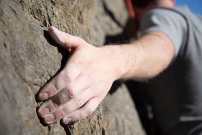 Close-up of hand on rock